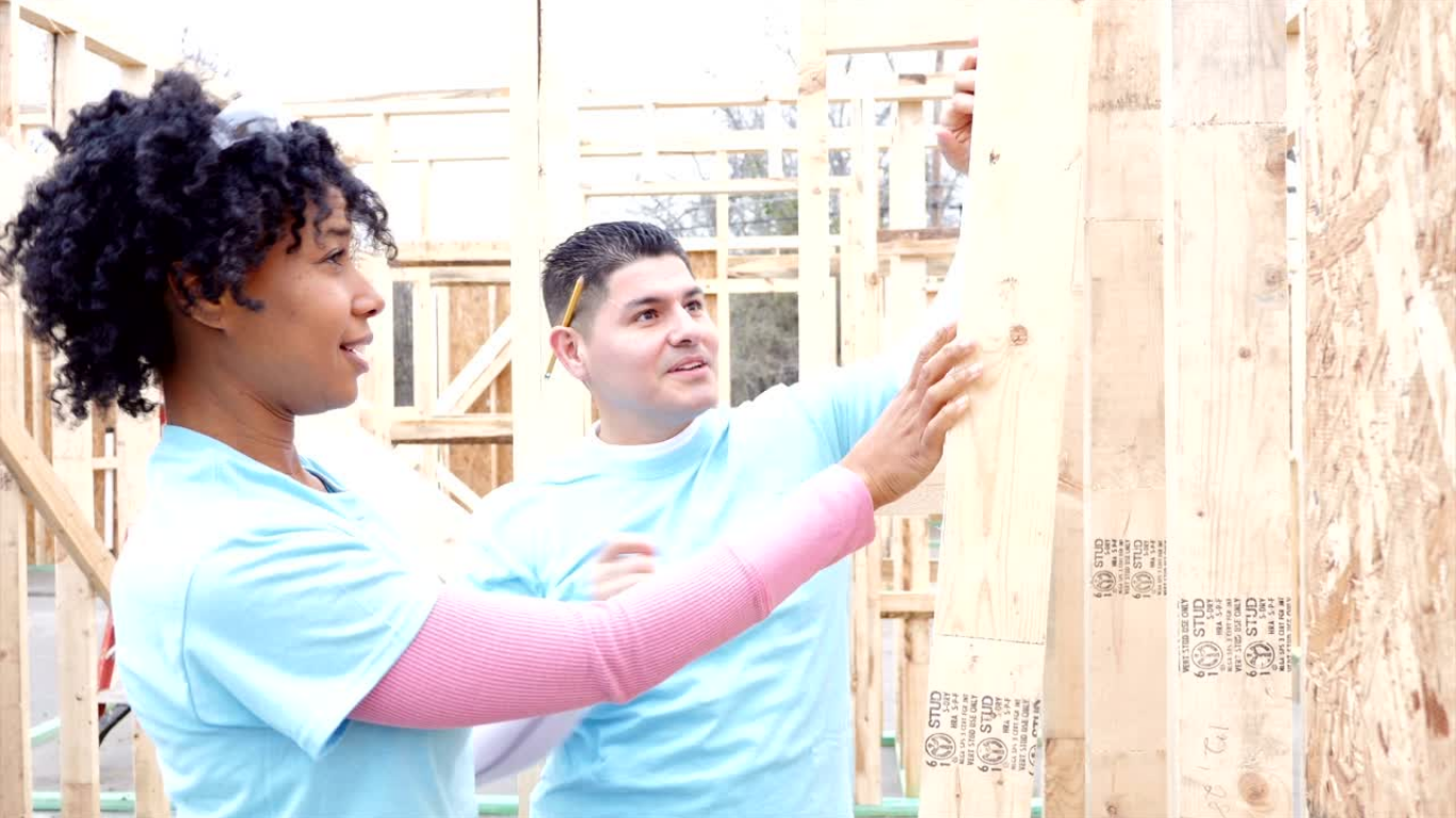 Neighbors working together to improve a home